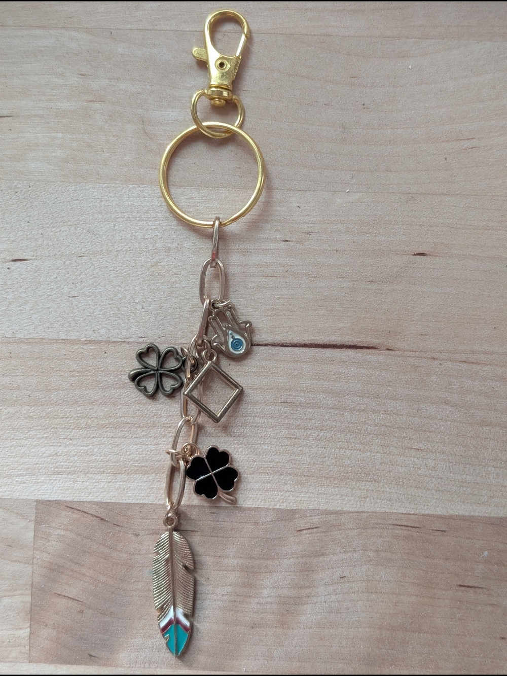 Gold-Tone Lucky Charm Keychain with Black Clover and Turquoise Feather